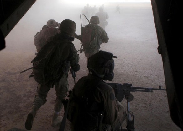 Marines and Georgian Soldiers with 33rd Georgian Battalion exit an MV-22 Osprey aircraft during an operation in Helmand province, Afghanistan, Sept. 23, 2013. Marine Medium Tiltrotor Squadron 165 provided the service members with aerial support during the operation / Photo by Cpl. Ashley E. Santy