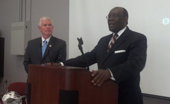 Congressman Mo Brooks (left) watches a negro.