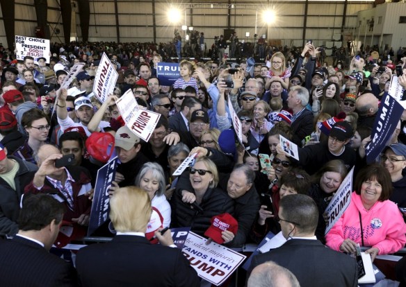 U.S. Republican presidential candidate Trump greets supporters after a campaign event in Bentonville Regional Airport near Bentonville